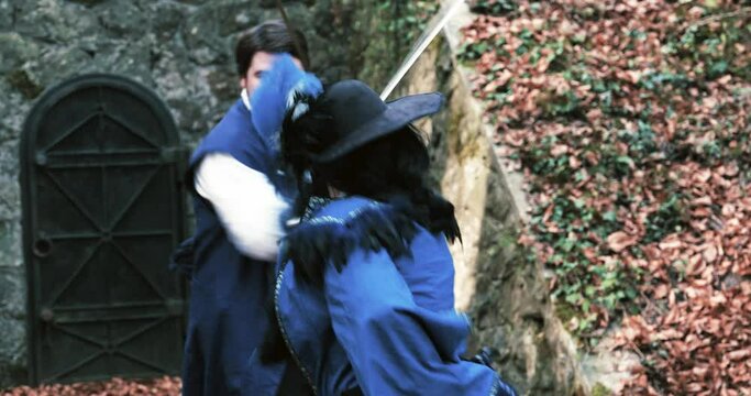 Two musketeers fencing background door