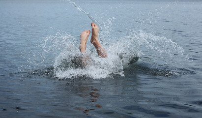 Man jumps into the lake