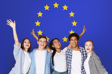 Student Exchange Programs In Eu. Multiracial Teens Posing Over Europe Union Flag © Prostock-studio