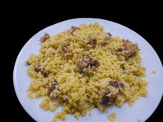 Tehari - South Asian beef Biriyani made with mustard oil with a black background. A famous dish in Bangladesh