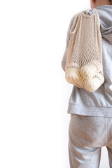 Homemade pot of Greek yogurt in glass jars in a string bag