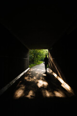 Man in a tunnel in the middle of the forest