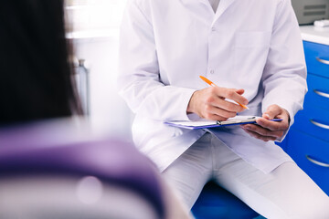 dentist writes the patient's answers. Doctor patient notes histo