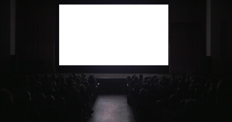 People in cinema hall. Viewers sitting in two rows watching on blank screen