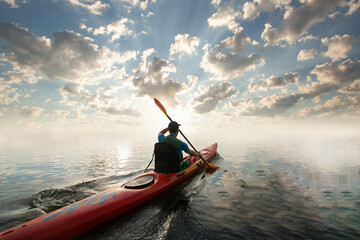 Kayaking. Man paddling a kayak. Canoeing, paddling.