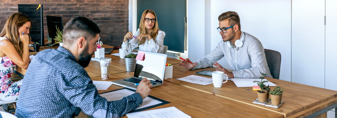 Young people at a business meeting in the office
