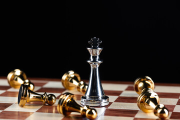 Silver king chess defeats gold pawns on board.