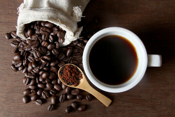 Coffee beans backgound on wooden table