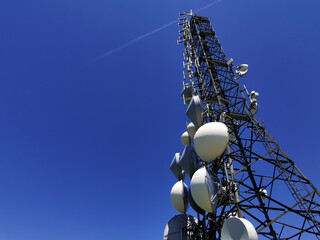 telecom cellular Communication Antenna tower on blue background - obrazy, fototapety, plakaty