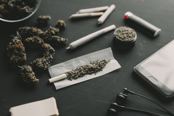 Close up of marijuana blunt with grinder. marijuana cannabis joint. Rolling a marijuana joint.