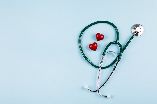 National Nurse Day Holiday Background. Medical stethoscope, two red hearts.