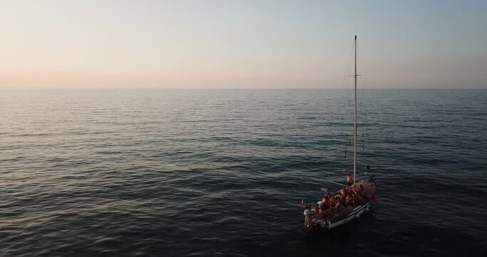 A boat with tourist at sunset near the beach of Cattolica, Emilia Romagna, Italy