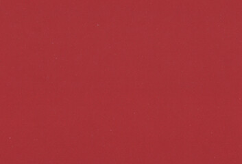 Sheet of red paper background with inclusions of different particles. Extra large highly detailed image.