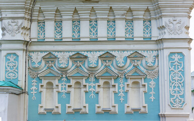 Fototapeta premium Patterns on the wall of the Bell Tower of St. Sophia Cathedral are angels and double headed eagles. Cultural monument Hagia Sophia in Kiev, a monument of architecture in the Ukrainian Baroque style.