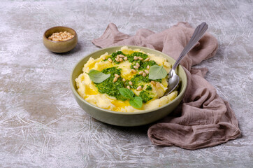 Mashed potatoes with green sauce