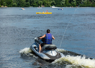 Man rides a jet ski on a river