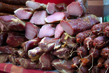 Ham, hamon iberico, pancetta, chorizo, kulen, prsut i kobasice sausages on the food market in Serbia