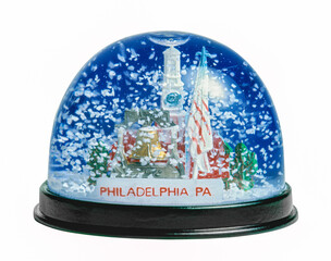 snow globe of Philadelphia with falling snow on white background