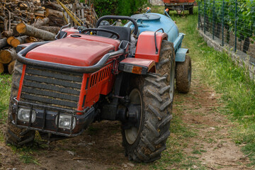 Obraz premium A red tractor in an Italian Farm house
