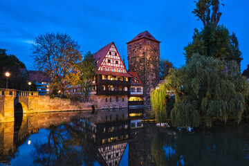 Fototapeta premium Nuremberg city houses on riverside of Pegnitz river from Maxbrucke (Max bridge). Nuremberg, Franconia, Bavaria, Germany