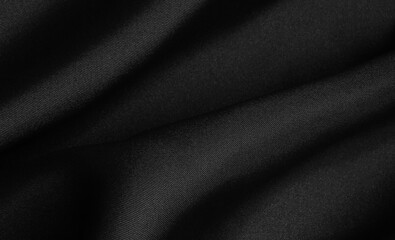 Obraz premium Black folded fabric. Liquid wavy background.