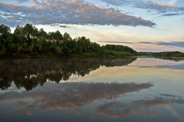 Fototapeta na wymiar gentle beautiful dawn on a small river
