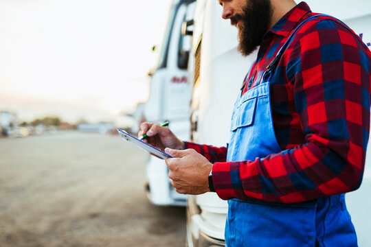 Truck Inspection And Safety, Truck Driver Daily Checking The Semi Truck Trailer.