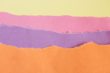 Abstract background of colored paper. Texture of torn paper edge. The concept of "back to school". Place for text.