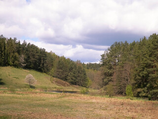 Fototapeta na wymiar Hills, meadows and forest typical landscape of Kashubian Region, Poland.