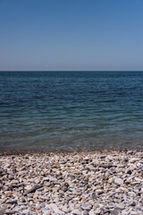 Clear blue-blue sea with a rocky shore. Black sea coast.