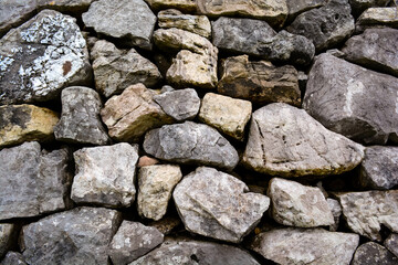 Pattern of decorative nature stone wall background in the park