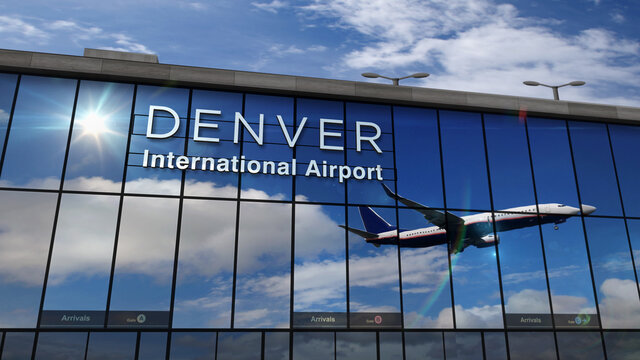 Airplane landing at Denver Colorado mirrored in terminal