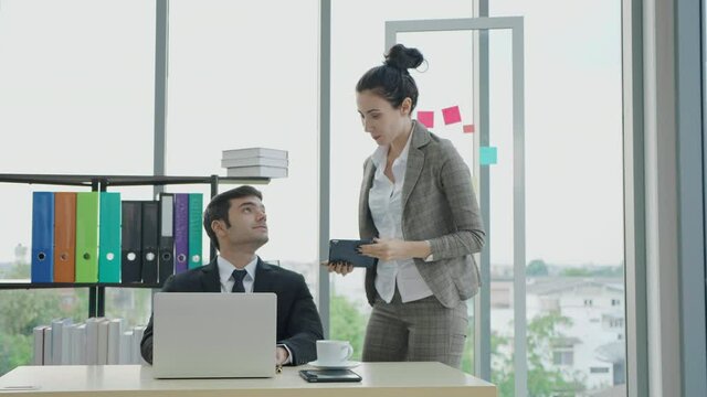 Business workmate in co-working office discuss contract details on tablet finish talk shaking hands, Executive manager effective meeting, synergy working together concept
