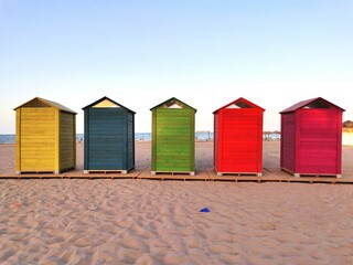 Five colored house on the beach