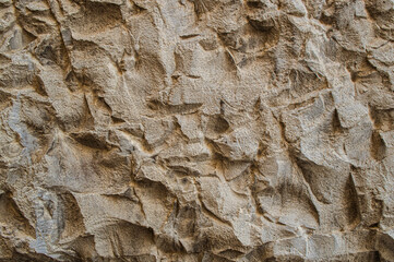 The texture of porous rough stone close-up.