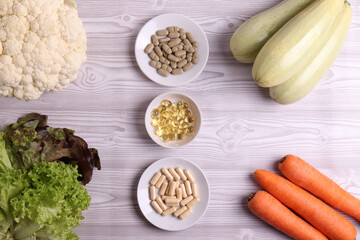 farm fresh vegetables and medical pills as a concept of comparison in healthy diet and vitamin supplies