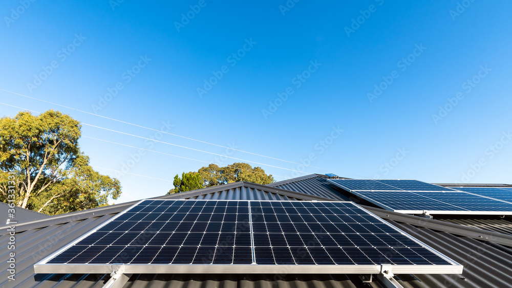 Wall mural new solar panels installed in landscape position on house roof in south australia