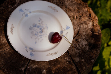 Heart shaped cherry berry in a plate