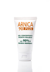 White plastic tube with Arnica 90 Plus gel isolated on white background.