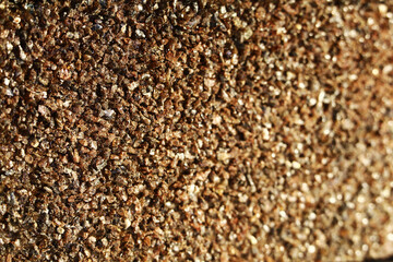 texture of dark sandpaper close-up. macro shot.