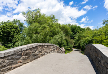 The Empty Gapstow Bridge over the Pond at Central Park with Green Trees during Spring in New York City