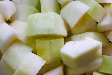 Fruit chopped white fresh melons. The dune is sliced