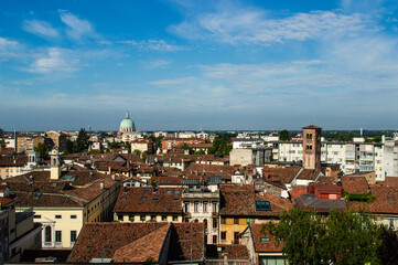 Fototapeta na wymiar Panoramic view from above with a dome and roofs of the city of Udine, Italy