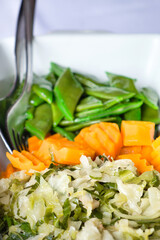 A variety of mixed vegetable salads of Madeira island - coleslaw salad with seaweed, pickled carrot and salty green beans