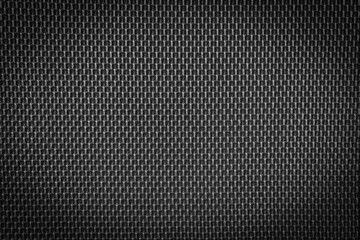 Black fabric textile texture for background, light on the center of textile texture background.