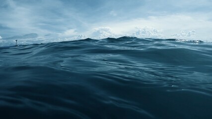 Wave on moving water surface close up in the middle of the screen.  Under Water Surface in the...