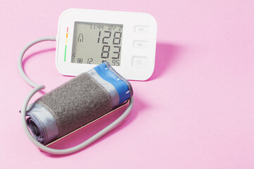 modern tonometer on pink background