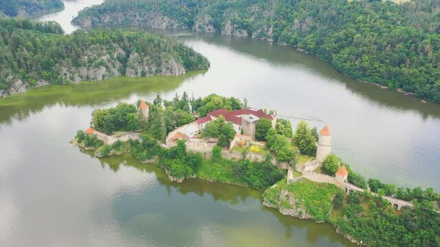Aerial view on czech medieval castle Zvikov, situated on rocky outcrop above the confluence of two rivers Vltava and Otava, Czech republic