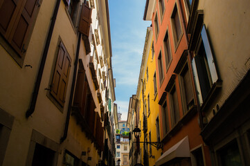 Fototapeta na wymiar Narrow Italian street with colorful houses.