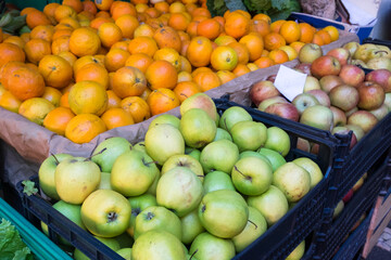 The variety of exotic tropical fruits including apples, oranges and passion fruit on the farmers' market in Funchal, Madeira island